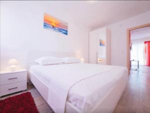 Posteľ alebo postele v izbe v ubytovaní House Karlo Apartments