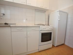 Kuchyňa alebo kuchynka v ubytovaní House Karlo Apartments