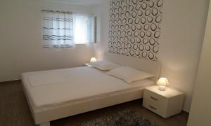 Posteľ alebo postele v izbe v ubytovaní House Karlo Apartments