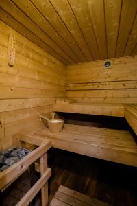 a wooden sauna with a bench inside of it at Houseboat Jana - with sauna and terrace in Bruges
