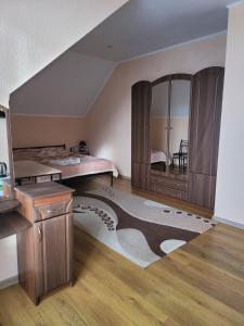 a bedroom with a bed and a large mirror at Vodnyi Mir in Bilhorod-Dnistrovsʼkyy
