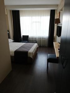 Postel nebo postele na pokoji v ubytování SİMİSSO HOTEL