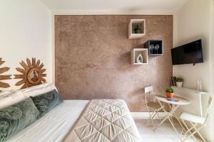 מיטה או מיטות בחדר ב-Ponte Vecchio Studio