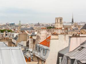 a view of the city from the roofs of buildings at Hotel le Lapin Blanc in Paris