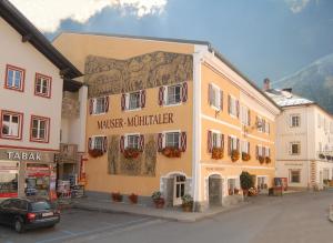a building with a mural on the side of it at Apartment Mauser-Mühltaler in Mauterndorf