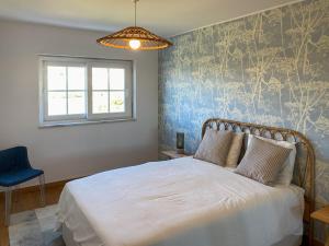 Postel nebo postele na pokoji v ubytování Cabanas de Tavira