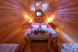 an overhead view of a bedroom in a log cabin at Chalet Zlatica Velika Planina in Stahovica