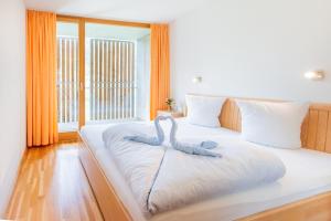Postel nebo postele na pokoji v ubytování Apartments Susanne