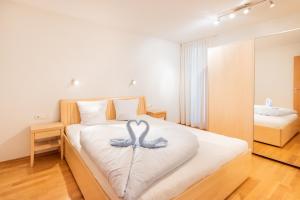 Postel nebo postele na pokoji v ubytování Apartments Susanne