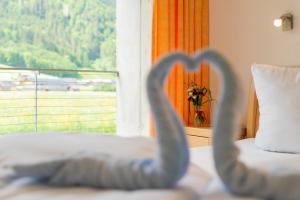 a bedroom with a bed and a window with a view at Apartments Susanne in Au im Bregenzerwald