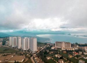 an aerial view of a city with a body of water at Wind Residence T4- M Near Taal view at Skylounge in Tagaytay