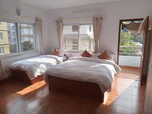 Postel nebo postele na pokoji v ubytování Eco Inn Guest House