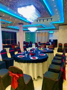 a banquet hall with a table and chairs at ruwanara royal majestry in Ambagahagedara +171 photos
