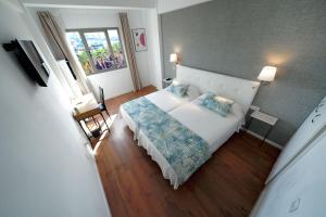 A bed or beds in a room at Hotel Matilde by Grupo Matilde