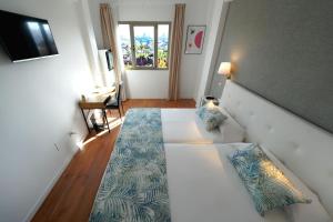 A bed or beds in a room at Hotel Matilde by Grupo Matilde