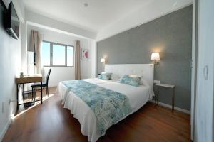A bed or beds in a room at Hotel Matilde by Grupo Matilde