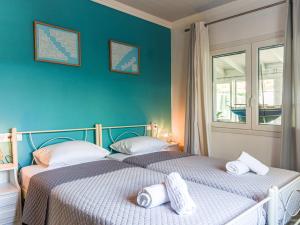 A bed or beds in a room at Casa Markapela