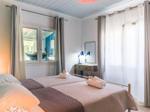 A bed or beds in a room at Casa Markapela