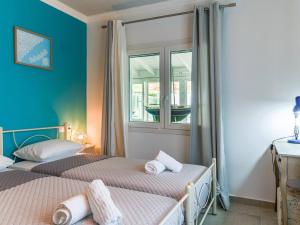 A bed or beds in a room at Casa Markapela