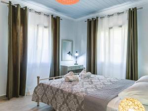 A bed or beds in a room at Casa Markapela