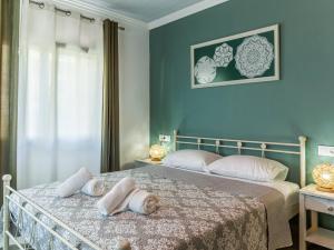 A bed or beds in a room at Casa Markapela
