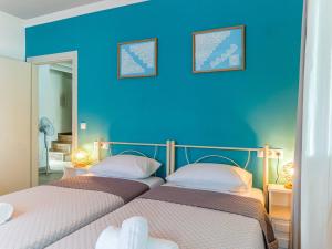 A bed or beds in a room at Casa Markapela