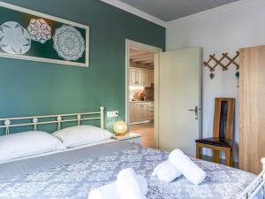 A bed or beds in a room at Casa Markapela