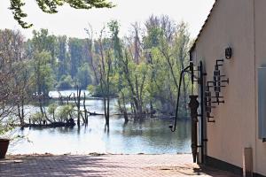 a view of a river from the side of a building at Ferienwohnung Fischerhütte Xanten in Xanten