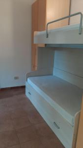 an empty bunk bed in a room at Appartamenti La Villa Peschici in Peschici
