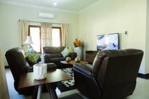 TV a/nebo společenská místnost v ubytování Bilene Home