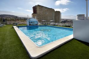 a large swimming pool on the roof of a building at Skyview Hotel Tenerife in Puerto de la Cruz