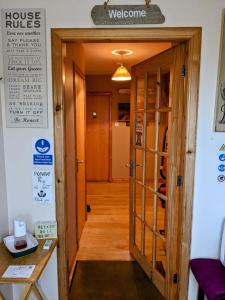 a room with a door leading to a kitchen at Hamnavoe B&B in John O Groats