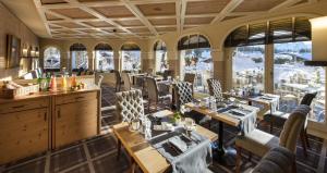 מסעדה או מקום אחר לאכול בו ב-GOLFHOTEL Les Hauts de Gstaad & SPA