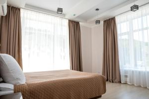 Cama o camas de una habitación en Park-Hotel Vishnevaya Gora