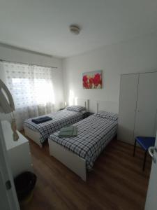 Een bed of bedden in een kamer bij Maison al Bivio (Locazione Turistica)