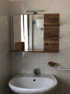 a bathroom with a sink and a mirror at Azienda Agrituristica Il Moraiolo in Foligno