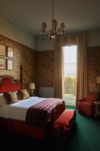 a bedroom with a large bed and a window at Marine North Berwick in North Berwick