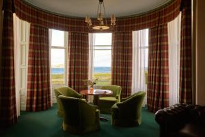 a room with chairs and a table and windows at Marine North Berwick in North Berwick