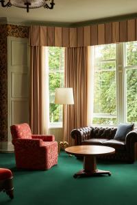 a living room with a couch and a chair and a table at Marine North Berwick in North Berwick