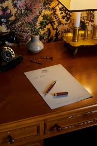 a desk with a pen and a paper on it at Marine North Berwick in North Berwick
