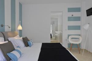Posteľ alebo postele v izbe v ubytovaní Romantica Suites
