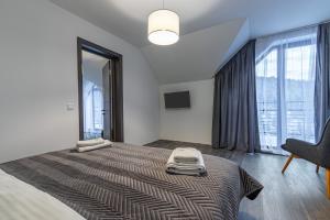 Konopka Forest Home & SPA客房内的一张或多张床位