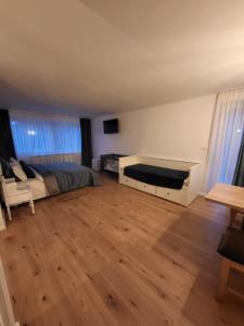 a bedroom with a bed and a desk at Eden By the Mountain in Bran
