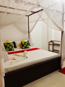Letto o letti in una camera di Pawana Rest