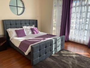 Кровать или кровати в номере Takdiri Homes
