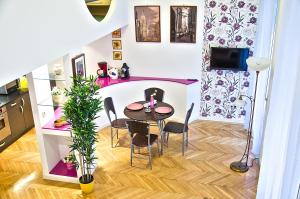 a small dining room with a table and chairs at The Fashion Street Apartment in Budapest