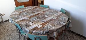 a table with chairs and a table cloth on it at Al Ponte in Ferrara +15 photos