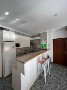 A kitchen or kitchenette at TORREPEREA- Piso completo