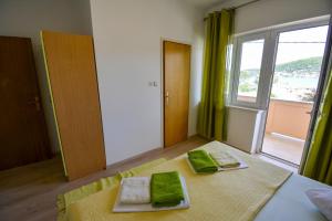 Postel nebo postele na pokoji v ubytování Apartmani Zlata