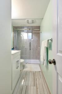 a bathroom with a shower and a toilet and a sink at Private Room near Airport in Mississauga